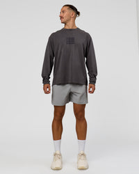 Man wearing Move Fast Heavyweight Oversized Long Sleeve Tee - Dark Storm Washed | Model:Jaiden | Size:M | Thumbnail Index: 2