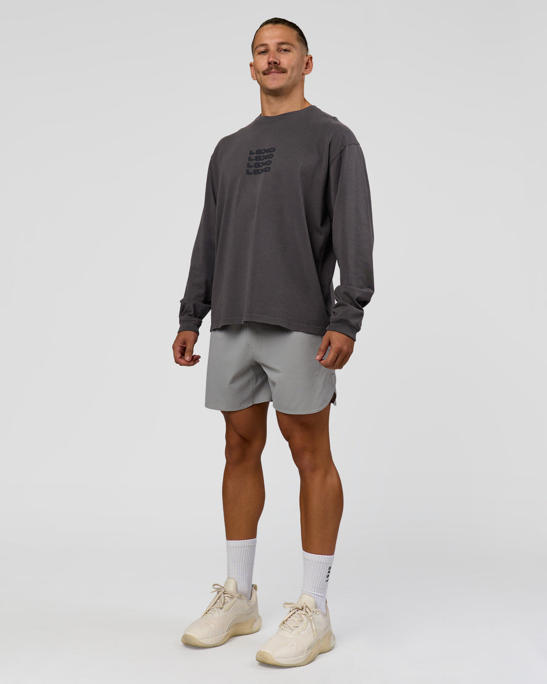 Man wearing Move Fast Heavyweight Oversized Long Sleeve Tee - Dark Storm Washed | Model:Jaiden | Size:M - view 5