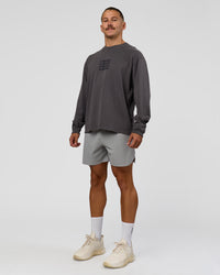 Man wearing Move Fast Heavyweight Oversized Long Sleeve Tee - Dark Storm Washed | Model:Jaiden | Size:M | Thumbnail Index: 4