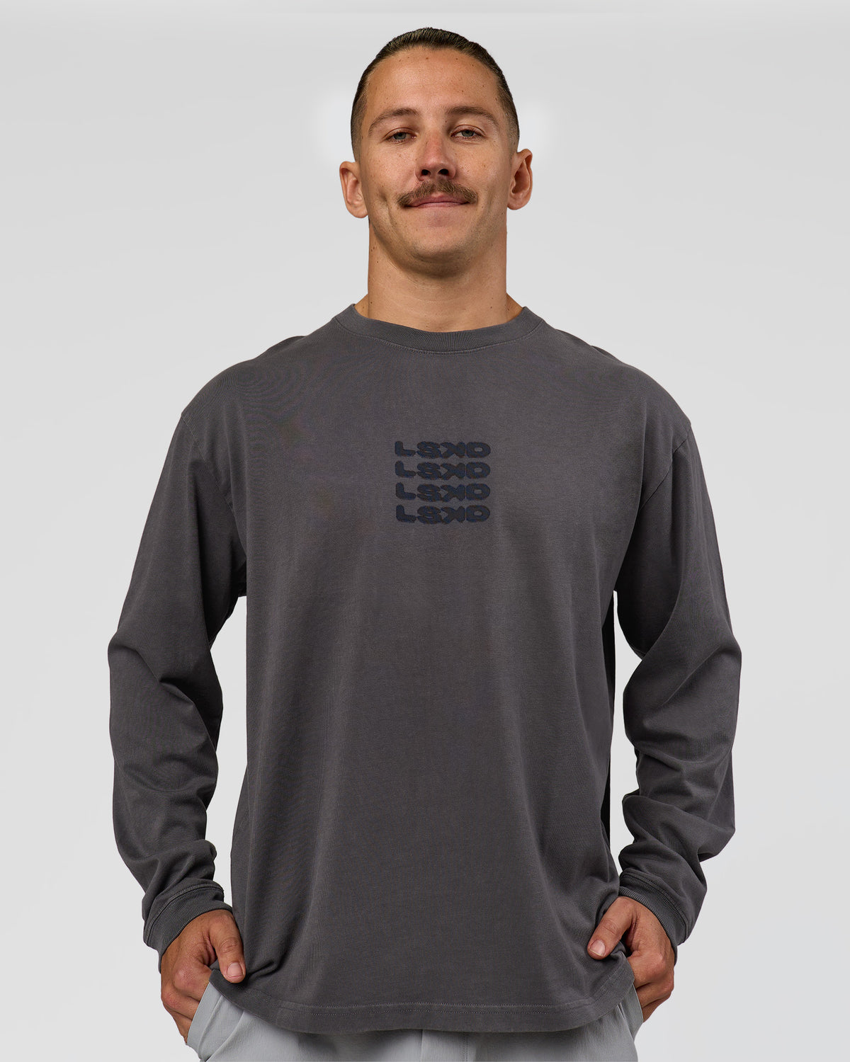 Man wearing Move Fast Heavyweight Oversized Long Sleeve Tee - Dark Storm Washed | Model:Jaiden | Size:M