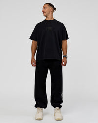 Man wearing Move Fast Heavyweight Oversized Tee - Black Washed | Model:Jaiden | Size:M | Thumbnail Index: 5