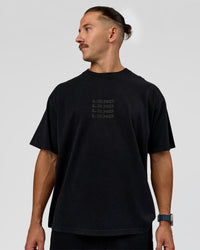 Man wearing Move Fast Heavyweight Oversized Tee - Black Washed | Model:Jaiden | Size:M | Thumbnail Index: 1