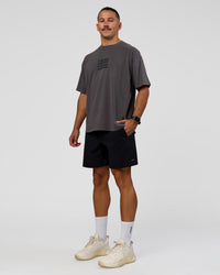 Man wearing Move Fast Heavyweight Oversized Tee - Dark Storm Washed | Model:Jaiden | Size:M | Thumbnail Index: 2