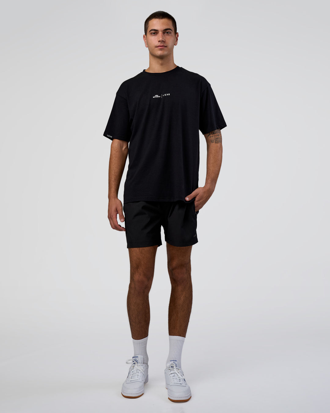 Man wearing Movember 2025 FLXCotton Oversize Tee - Black | Model:Zoran | Size:M - view 6