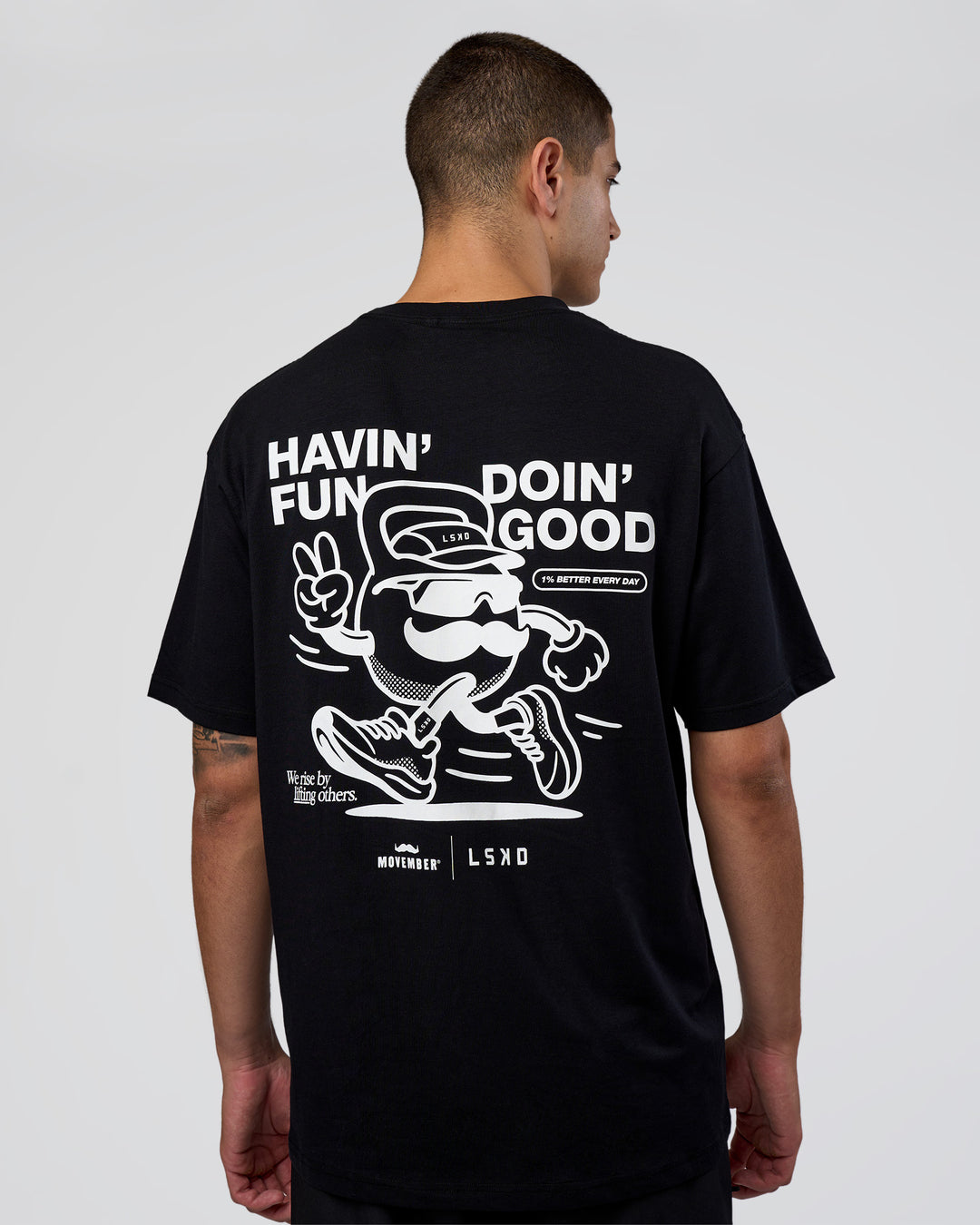 Man wearing Movember 2025 FLXCotton Oversize Tee - Black | Model:Zoran | Size:M - view 2
