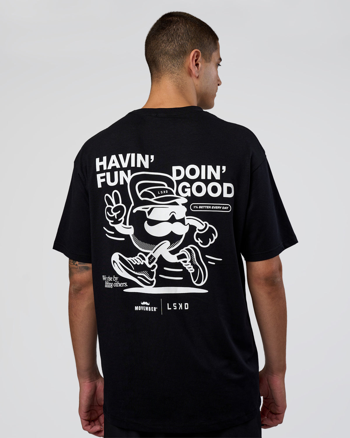 Man wearing Movember 2025 FLXCotton Oversize Tee - Black | Model:Zoran | Size:M