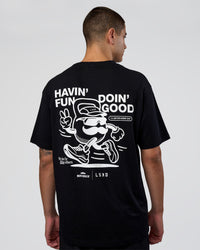 Man wearing Movember 2025 FLXCotton Oversize Tee - Black | Model:Zoran | Size:M | Thumbnail Index: 1