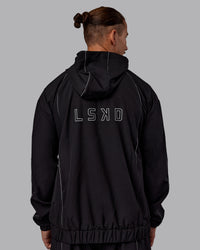 Man wearing Nocturnal Oversized Zip Jacket - Black | Model:Jaiden | Size:M | Thumbnail Index: 4