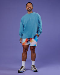 Man wearing Our Journey Oversize Heavyweight FLXCotton Long Sleeve Tee - Azure Blue | Model:Justin | Size:M | Thumbnail Index: 11