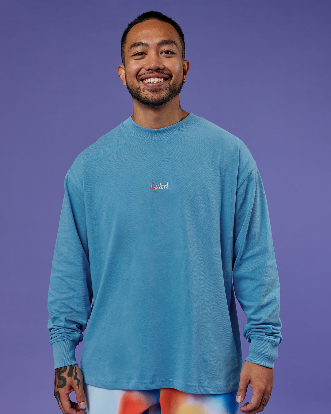 Man wearing Our Journey Oversize Heavyweight FLXCotton Long Sleeve Tee - Azure Blue | Model:Justin | Size:M - view 3