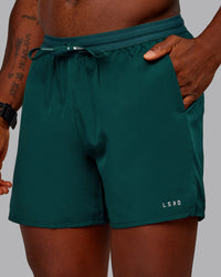 Man wearing Pace Lined Performance Short  5" in Dark Moss | Size:M | Thumbnail Index: 0