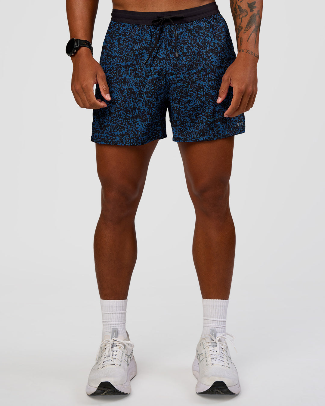 Man wearing Pace 5" Lined Running Short - Energy Print Palace Blue | Model:Malebo | Size:M - view 1