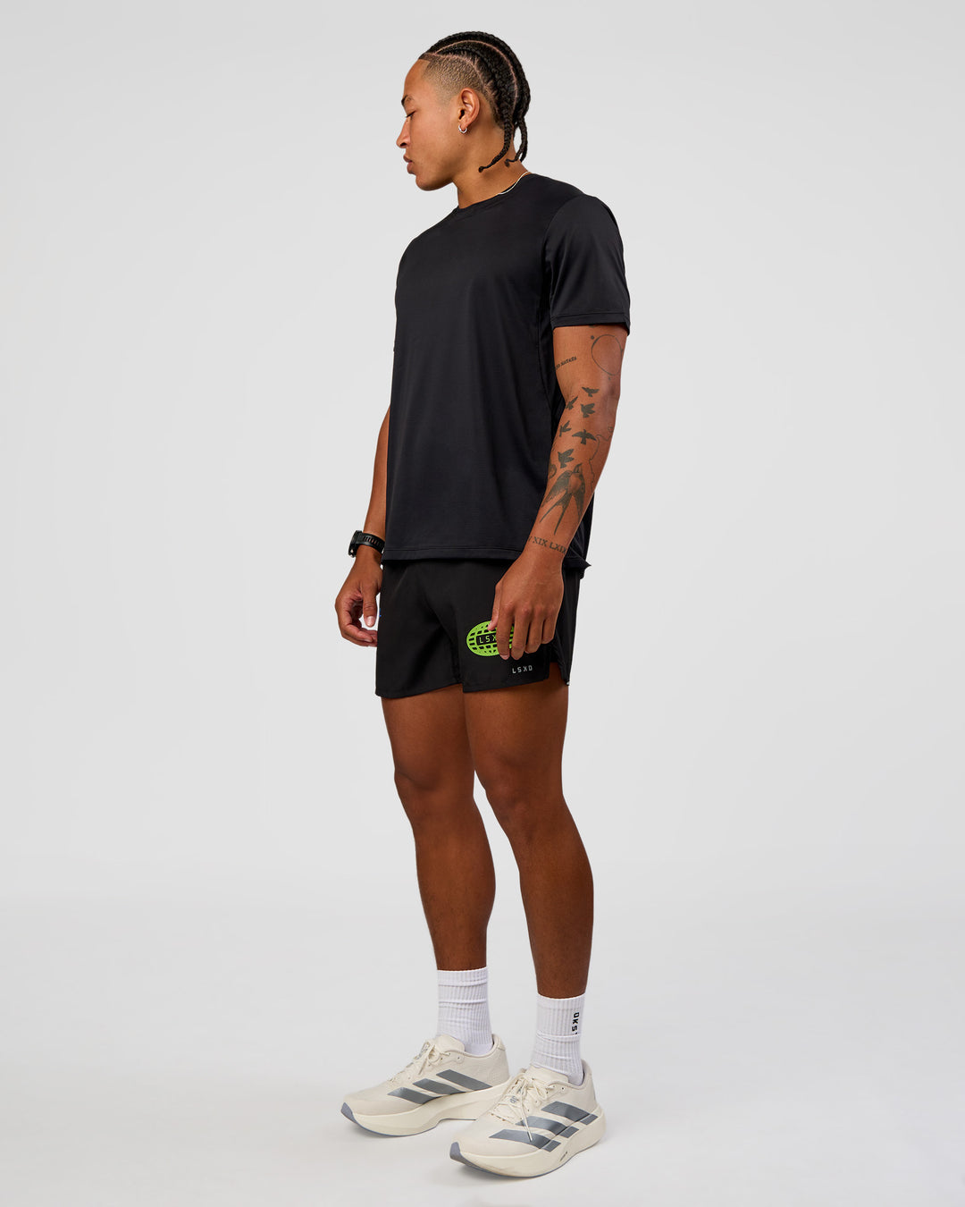 Man wearing Pace 5" Lined Running Short - Black-Lime Glo Indigo | Model:Malebo | Size:M - view 8
