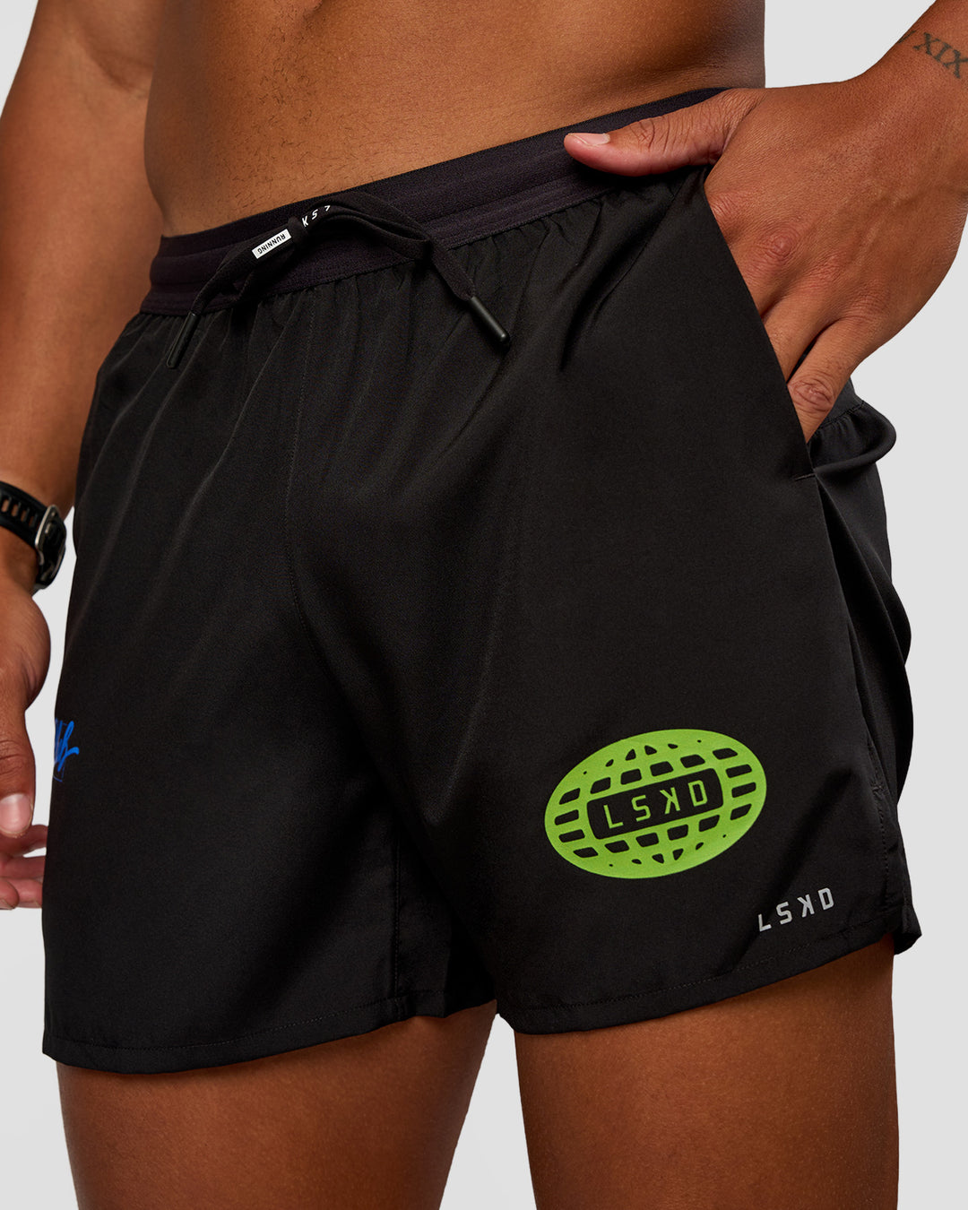 Man wearing Pace 5" Lined Running Short - Black-Lime Glo Indigo | Model:Malebo | Size:M - view 1