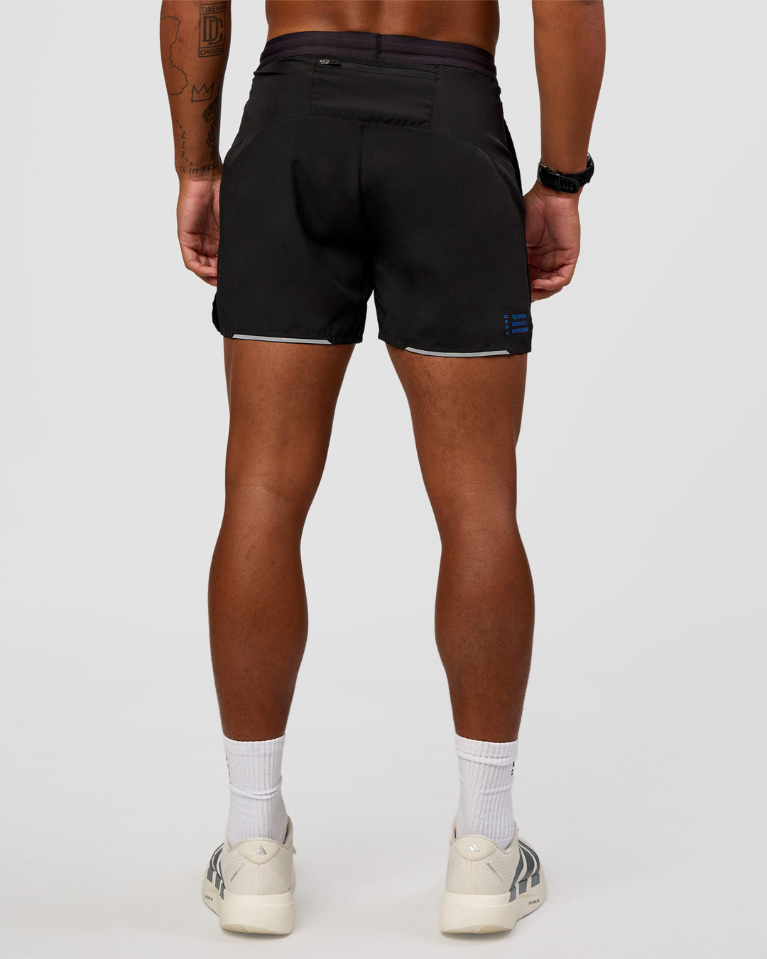 Man wearing Pace 5" Lined Running Short - Black-Lime Glo Indigo | Model:Malebo | Size:M - view 5