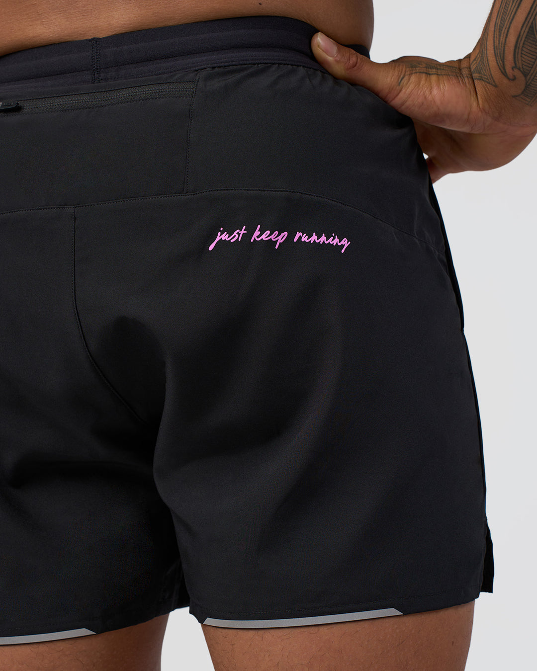 Man wearing Pace 5" Lined Running Short - Black-Ultra Fuchsia | Model:Daarian | Size:M - view 9