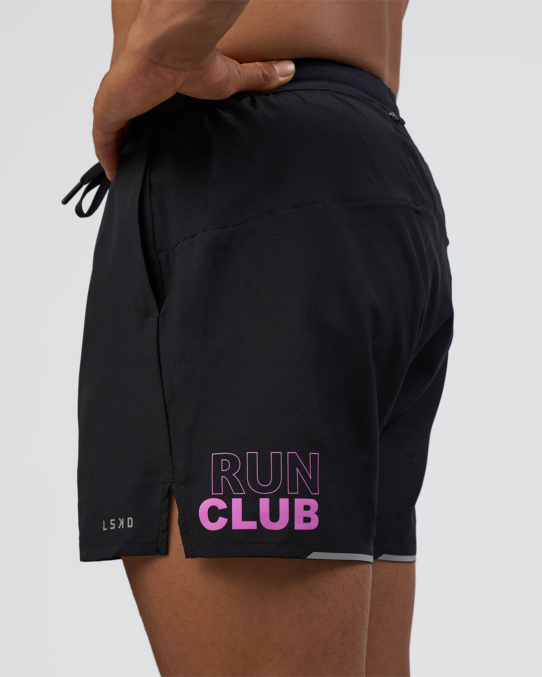 Man wearing Pace 5" Lined Running Short - Black-Ultra Fuchsia | Model:Daarian | Size:M - view 1