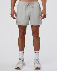 Man wearing Pace 5" Lined Running Short - Digital Mist-Flame | Model:Konnor | Size:M | Thumbnail Index: 0