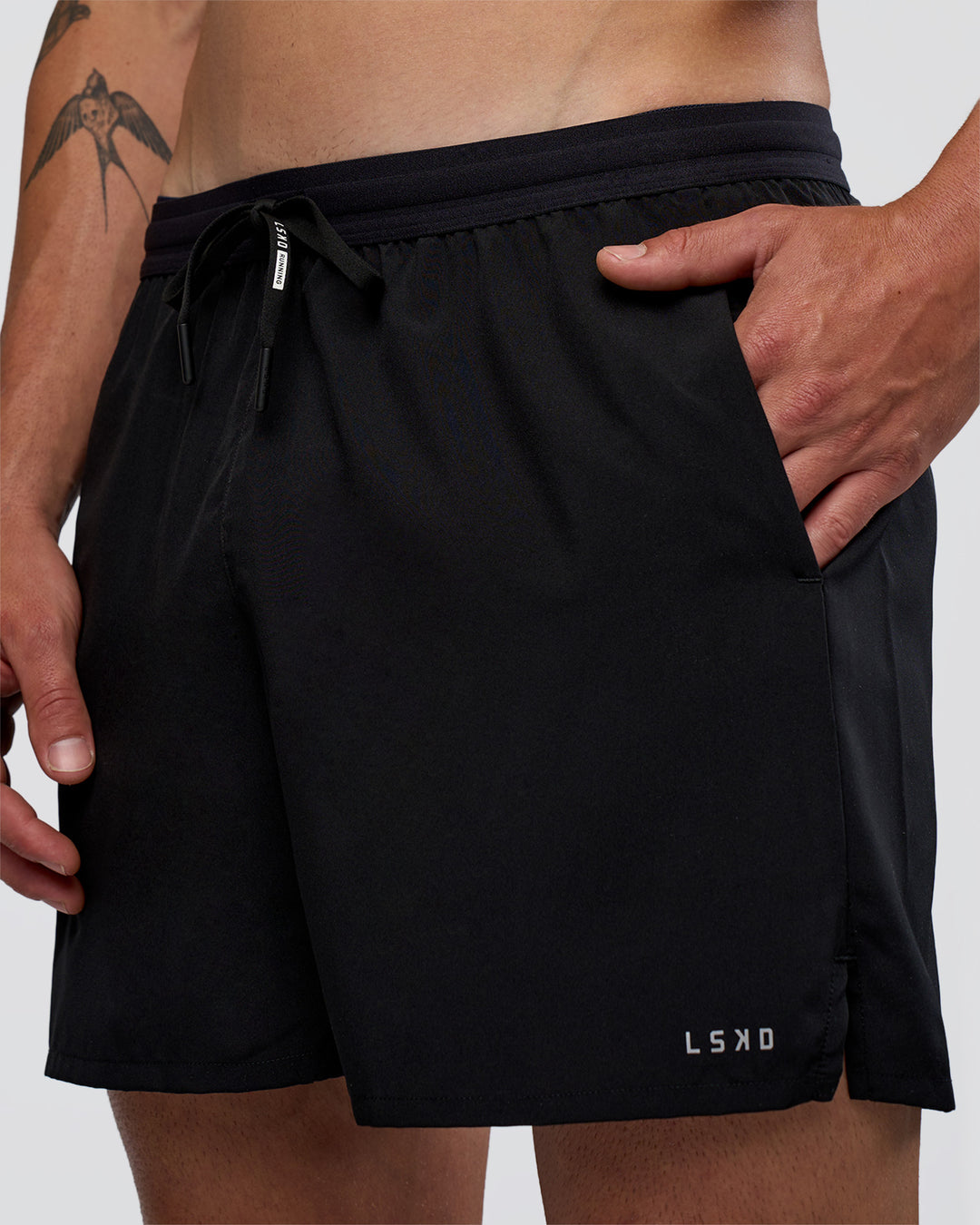 Man wearing Pace 5" Running Short - Black | Model:Konnor | Size:M - view 2