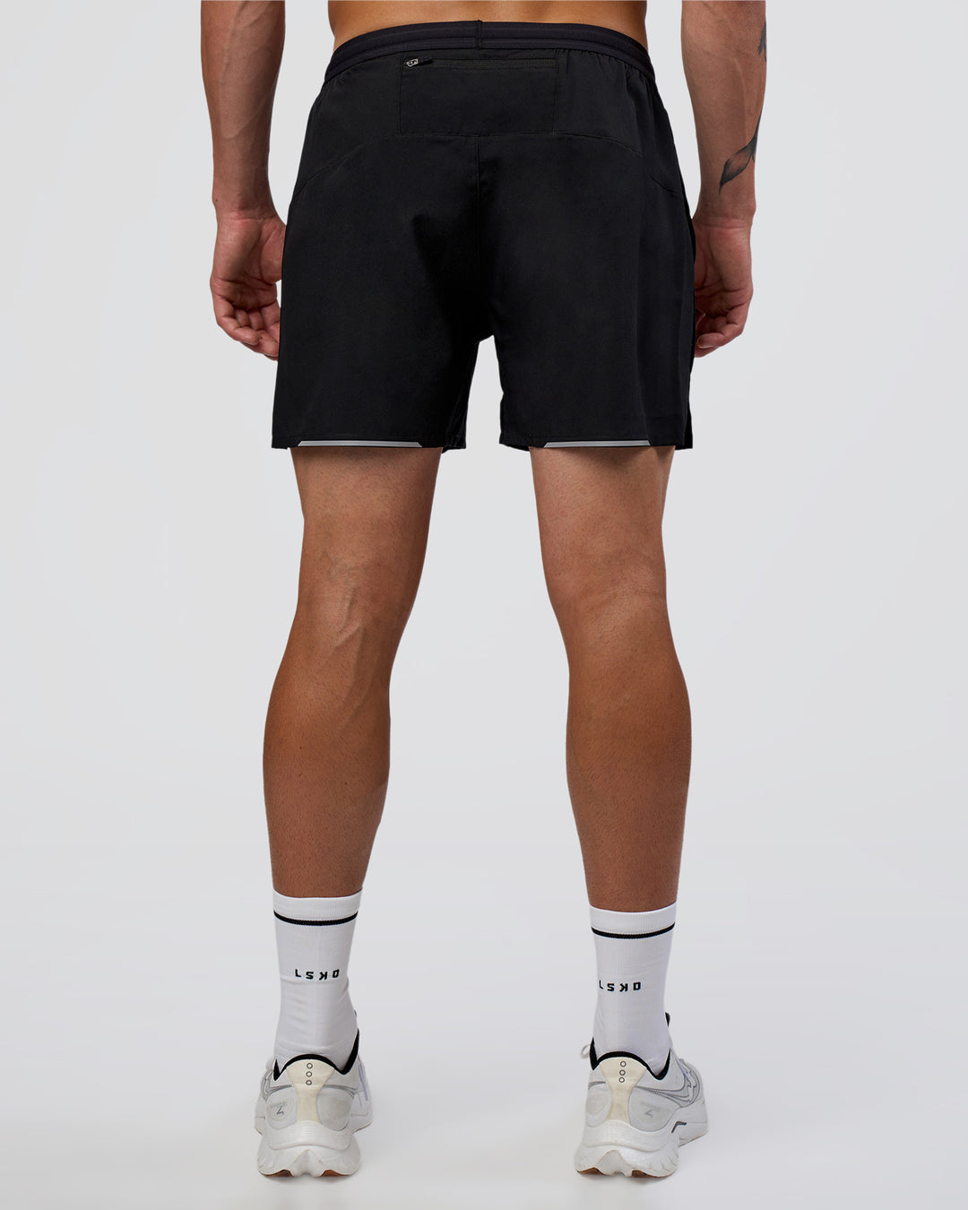 Man wearing Pace 5" Running Short - Black | Model:Konnor | Size:M - view 4
