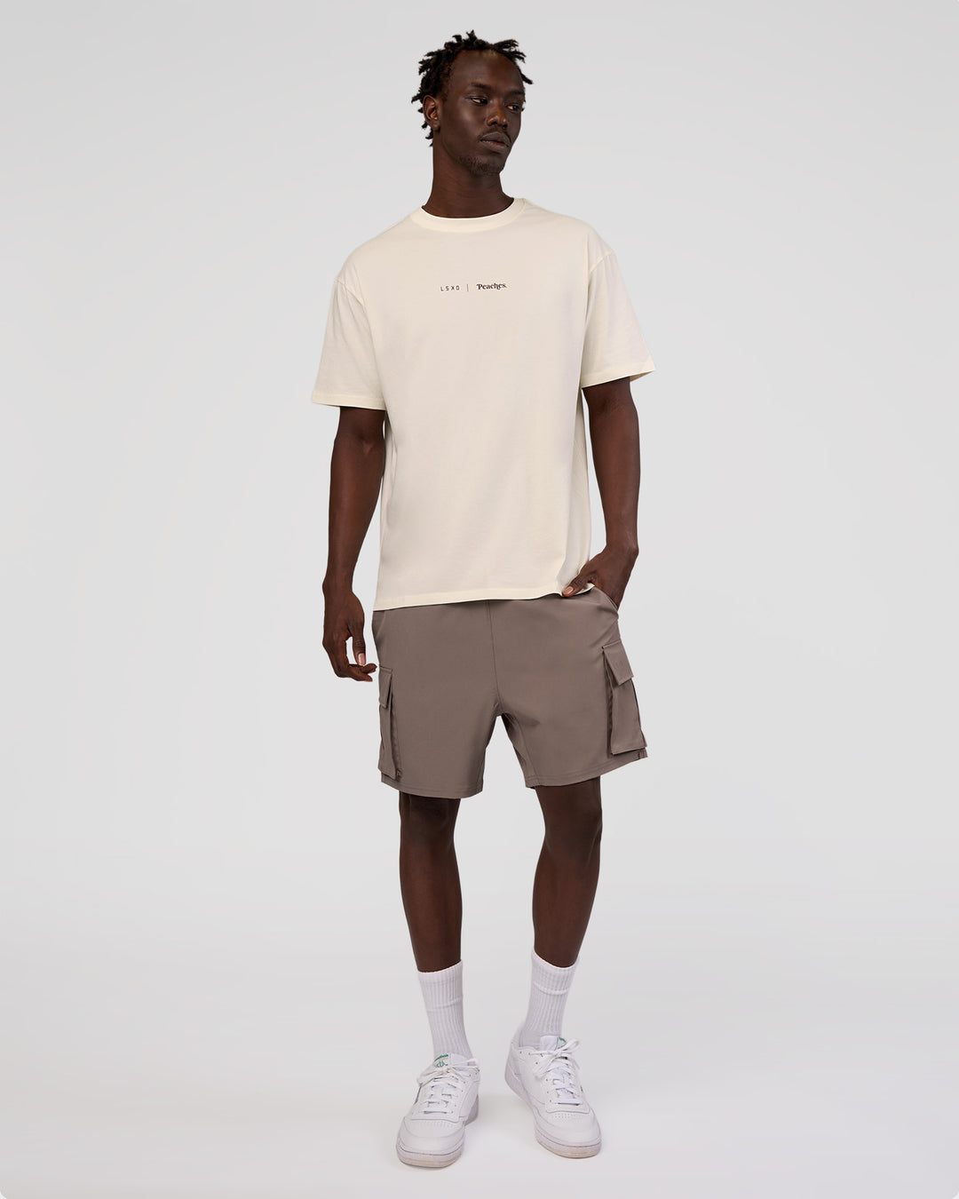 Man wearing Peaches x LSKD Collection FLXCotton Oversize Tee - Off White | Model:Okello | Size:M - view 8