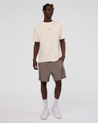 Man wearing Peaches x LSKD Collection FLXCotton Oversize Tee - Off White | Model:Okello | Size:M | Thumbnail Index: 7