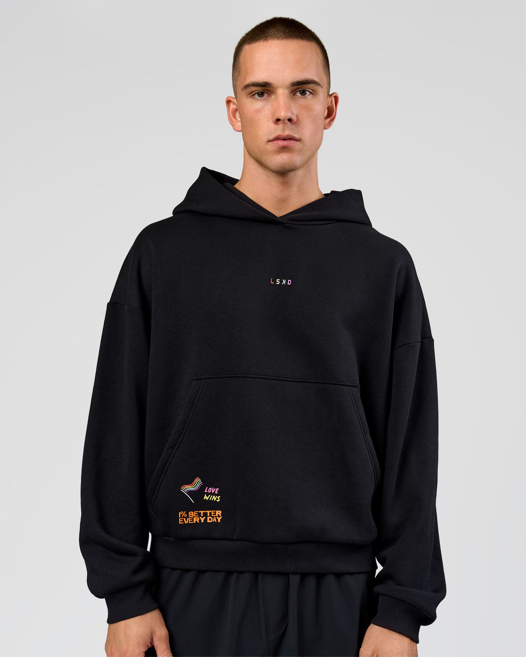 Man wearing Pride Sticker Boxy Hoodie - Black | Model:Albert | Size:M - view 18