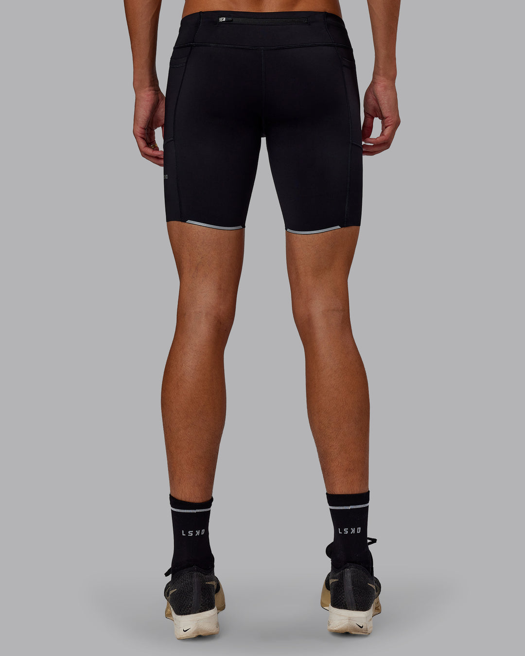 Man wearing Race Day Short Tight 8" in Black | Model:Jaxon | Size:M - view 3