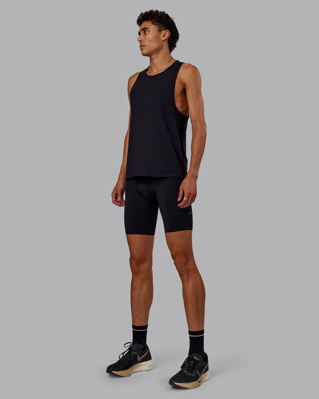 Man wearing Race Day Short Tight 8" in Black | Model:Jaxon | Size:M - view 4