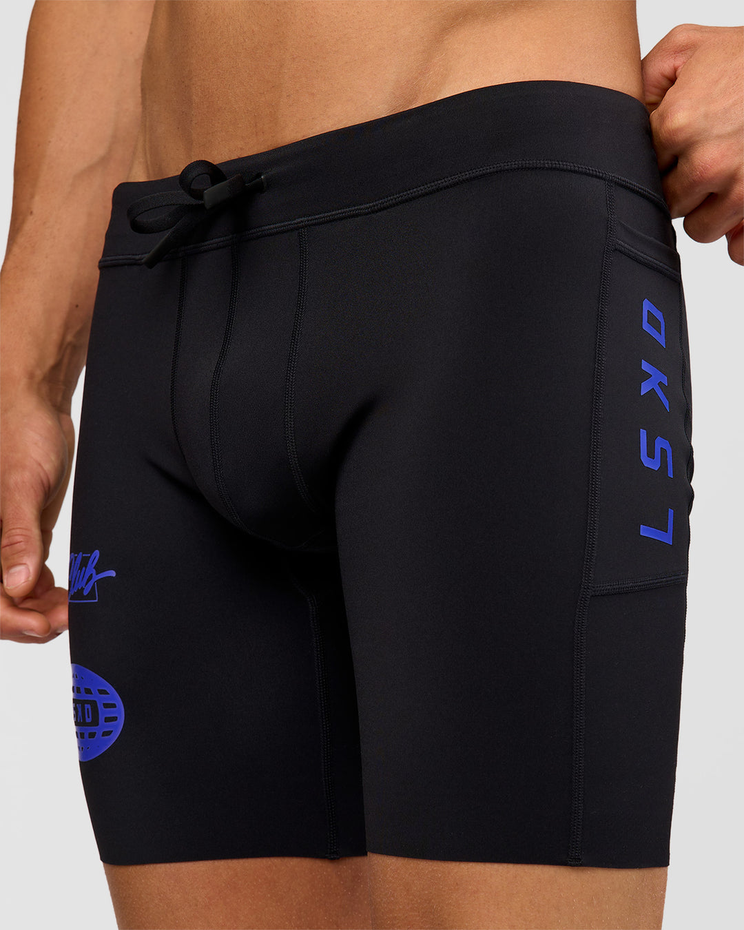 Man wearing Race Day 8" Short Tight - Black-Electric Indigo | Model:Albert | Size:M | - view 1