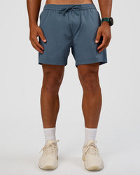 Man wearing Rep 5" Performance Short - Blue Mirage | Model:George | Size:M | Thumbnail Index: 0