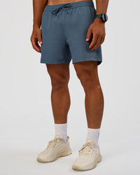 Man wearing Rep 5" Performance Short - Blue Mirage | Model:George | Size:M | Thumbnail Index: 4