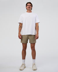 Man wearing Rep 5" Performance Short - Greige | Model:Konnor | Size:M | Thumbnail Index: 1