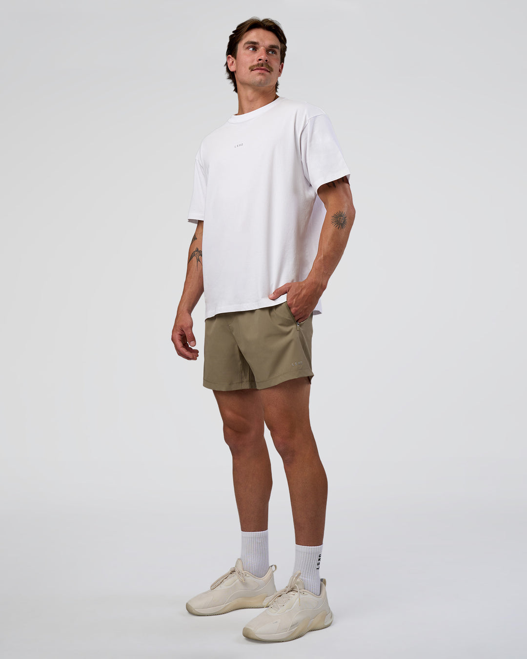 Man wearing Rep 5" Performance Short - Greige | Model:Konnor | Size:M - view 5
