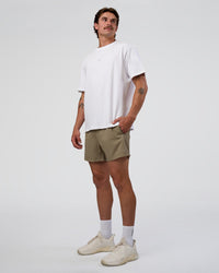 Man wearing Rep 5" Performance Short - Greige | Model:Konnor | Size:M | Thumbnail Index: 4