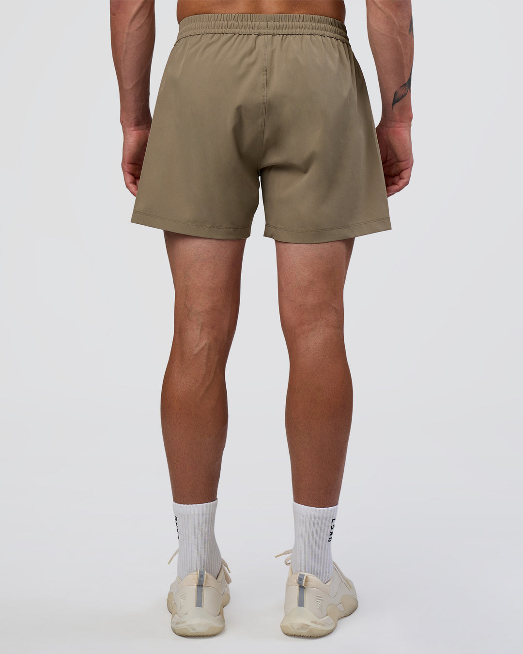 Man wearing Rep 5" Performance Short - Greige | Model:Konnor | Size:M - view 4