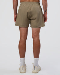 Man wearing Rep 5" Performance Short - Greige | Model:Konnor | Size:M | Thumbnail Index: 3