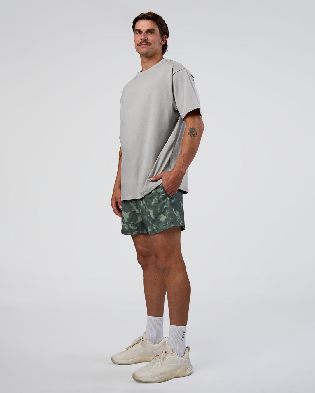 Man wearing Rep 5" Performance Short - Washed Camo Carbon | Model:Konnor | Size:M - view 3