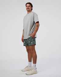 Man wearing Rep 5" Performance Short - Washed Camo Carbon | Model:Konnor | Size:M | Thumbnail Index: 2