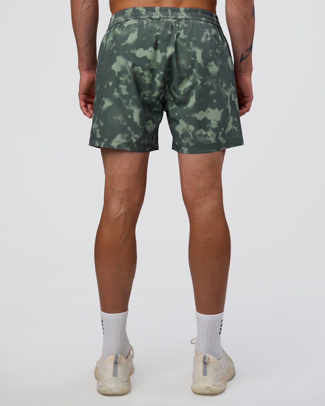 Man wearing Rep 5" Performance Short - Washed Camo Carbon | Model:Konnor | Size:M - view 4