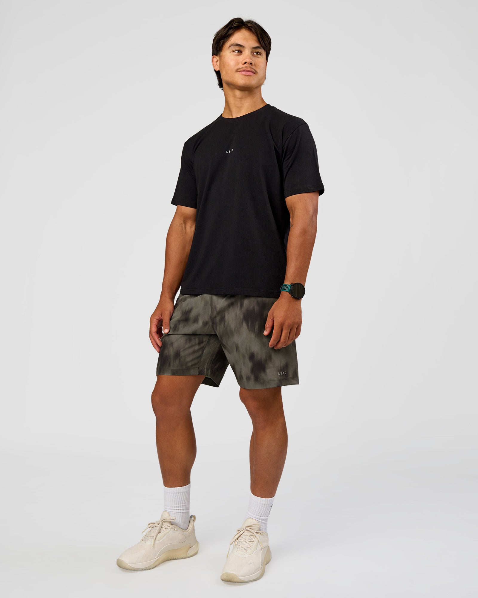 Man wearing Rep 7" Performance Short - Camo Washed Walnut Grey | Model:George | Size:M