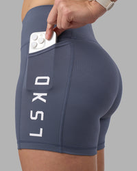Woman wearing Rep Ultra High-Rise 4" Short Pockets - Night Shadow-White | Model:Amy | Size:M | Thumbnail Index: 0