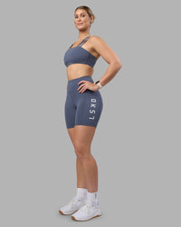 Woman wearing Rep Ultra High-Rise 6" Short Pockets - Night Shadow-White | Model:Amy | Size:M | Thumbnail Index: 0