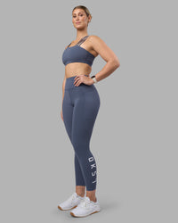 Woman wearing Rep Ultra High-Rise 7/8 Legging Pockets - Night Shadow-White | Model:Amy | Size:M | Thumbnail Index: 4