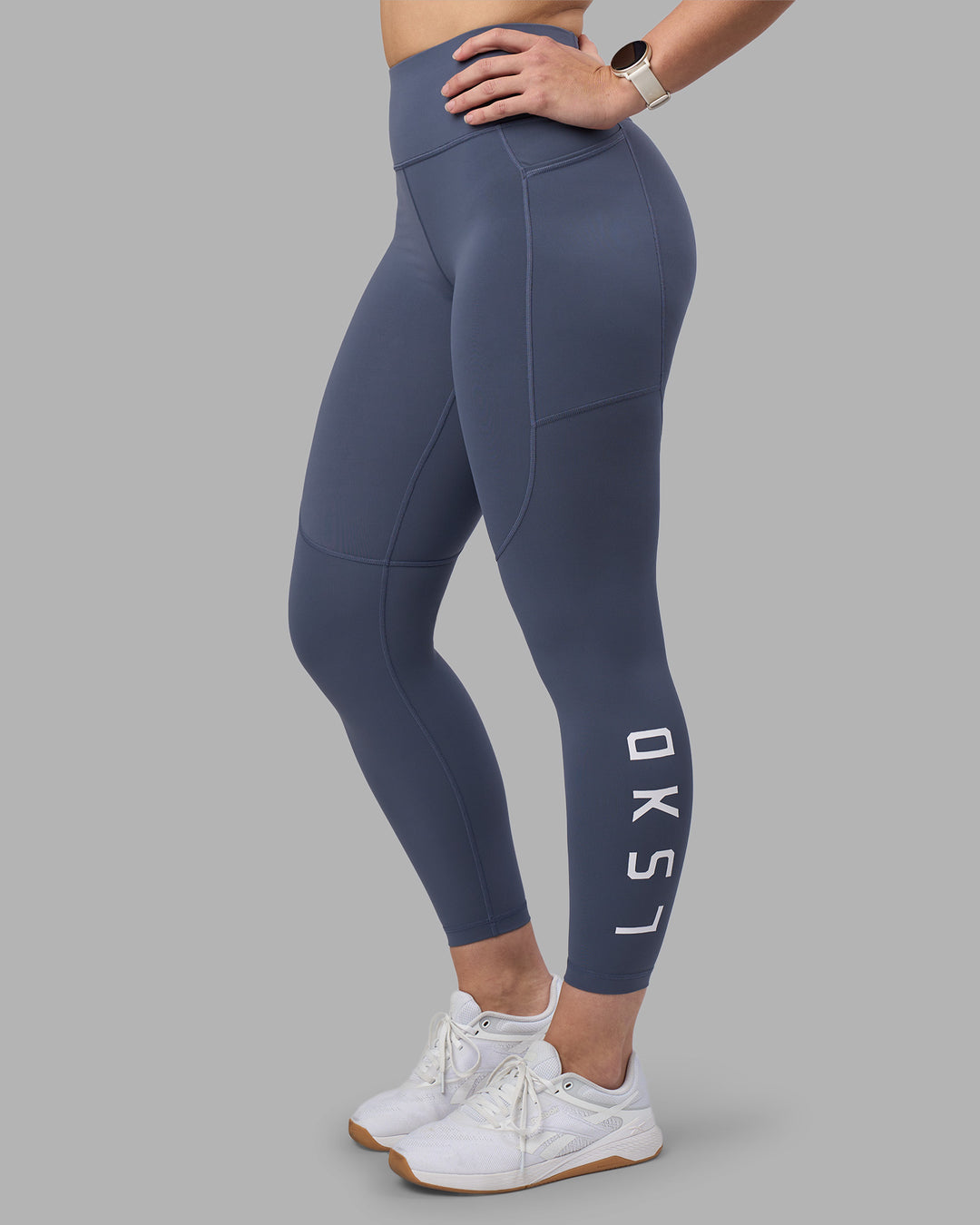 Woman wearing Rep Ultra High-Rise 7/8 Legging Pockets - Night Shadow-White | Model:Amy | Size:M - view 1