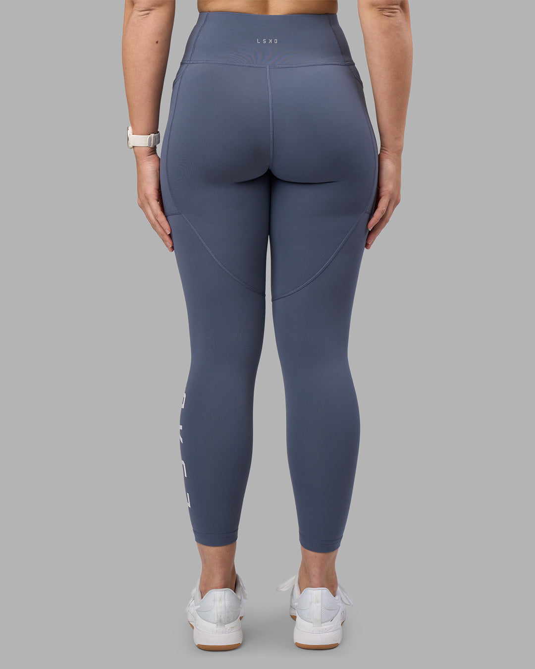 Woman wearing Rep Ultra High-Rise 7/8 Legging Pockets - Night Shadow-White | Model:Amy | Size:M - view 4