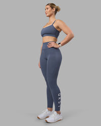 Woman wearing Rep Ultra High-Rise Full Length Legging Pockets - Night Shadow-White | Model:Amy | Size:M | Thumbnail Index: 0
