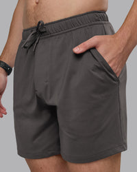 Man wearing Restore CloudFLX Short - Dark Storm | Model:Cameron | Size:M | Thumbnail Index: 1