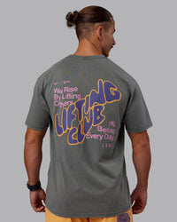 Man wearing Rise & Lift Washed FLXCotton Oversized Tee - Graphite-Purple Opulence | Model:Jaiden | Size:M | Thumbnail Index: 9