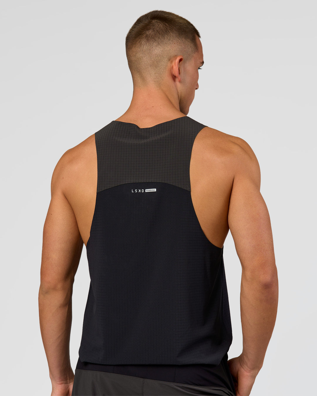 Man wearing Run Club Elevate Pace Running Tank - Black-Onyx | Model:Albert | Size:M - view 7